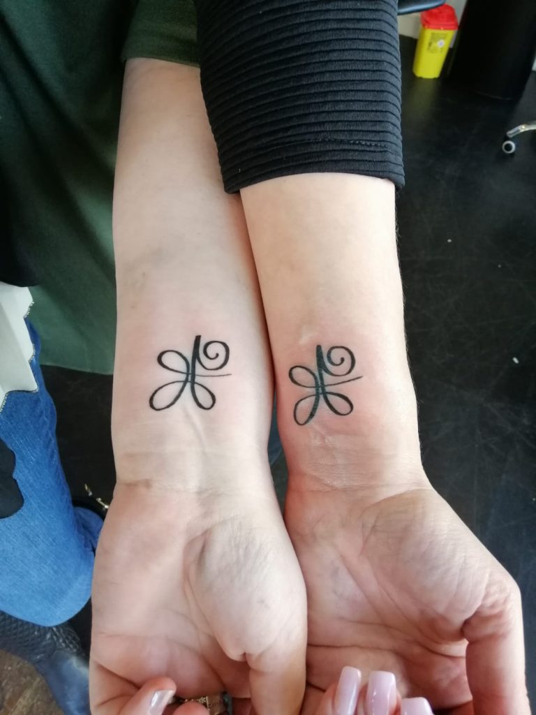symbol risk tattoo
