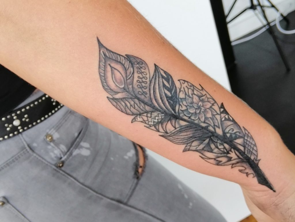 cover up feather tattoo